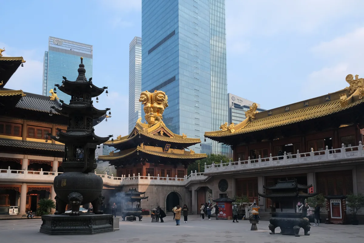 Golden roofs and a bronze incense burner in Jing’an Temple’s courtyard